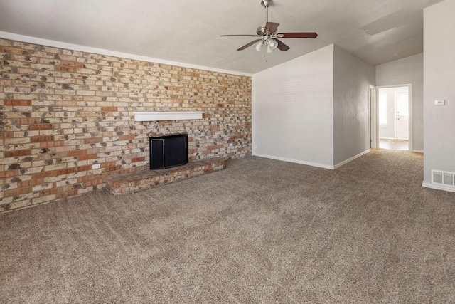 unfurnished living room with lofted ceiling, ceiling fan, a brick fireplace, carpet floors, and baseboards
