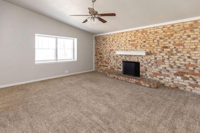 unfurnished living room featuring lofted ceiling, carpet, a ceiling fan, a fireplace, and baseboards