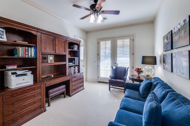 office space featuring crown molding, light carpet, and ceiling fan