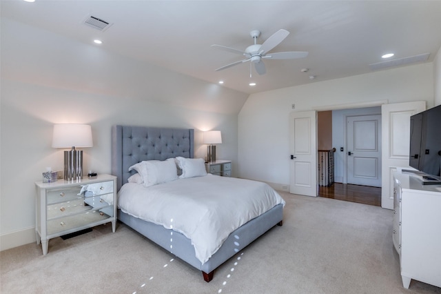 carpeted bedroom featuring ceiling fan and vaulted ceiling