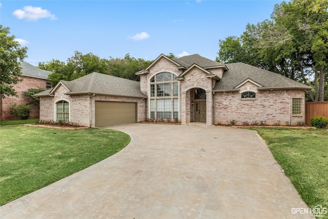 french country inspired facade with a garage and a front yard