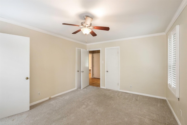 unfurnished bedroom with crown molding, ceiling fan, and light carpet