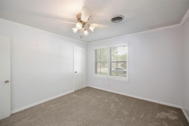 carpeted empty room with ornamental molding and ceiling fan