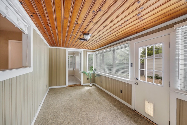 unfurnished sunroom featuring wooden ceiling