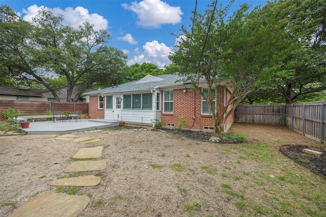 back of property featuring a patio