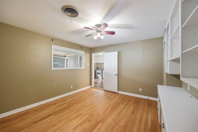 unfurnished bedroom with ceiling fan and light hardwood / wood-style flooring