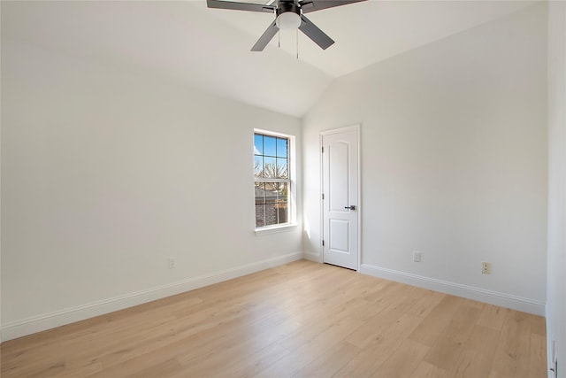 empty room featuring vaulted ceiling, ceiling fan, and light hardwood / wood-style floors