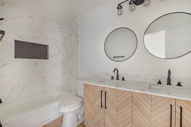 bathroom featuring a tub to relax in, toilet, wood-type flooring, and vanity