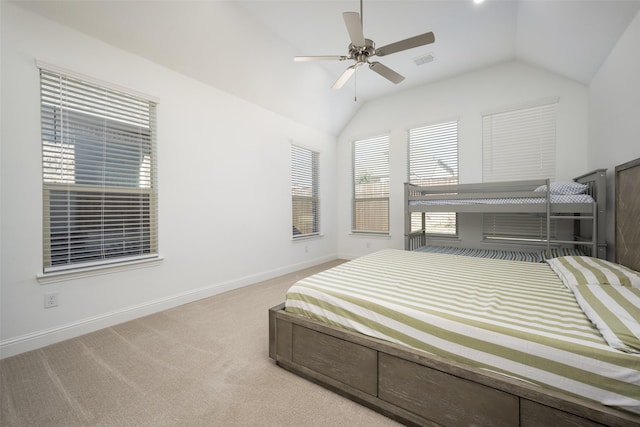 bedroom featuring ceiling fan, vaulted ceiling, and light carpet