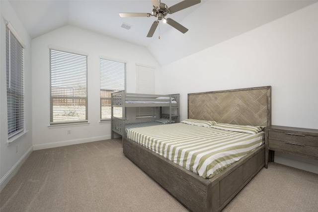 bedroom with lofted ceiling, light carpet, and ceiling fan