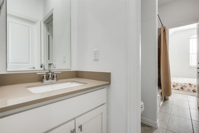 full bathroom featuring vanity, shower / tub combo, tile patterned floors, and toilet