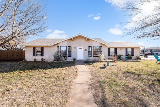 ranch-style house featuring a front lawn