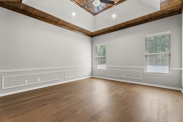 spare room featuring crown molding, ceiling fan, wood-type flooring, and wooden ceiling