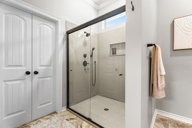 bathroom with a shower with door