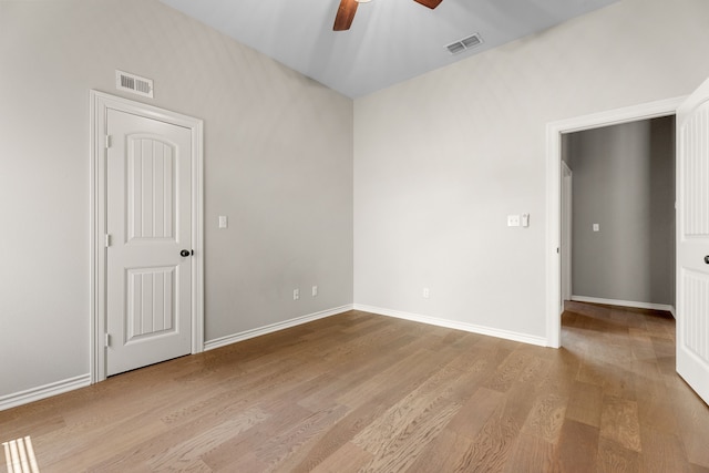 unfurnished room with ceiling fan and light wood-type flooring