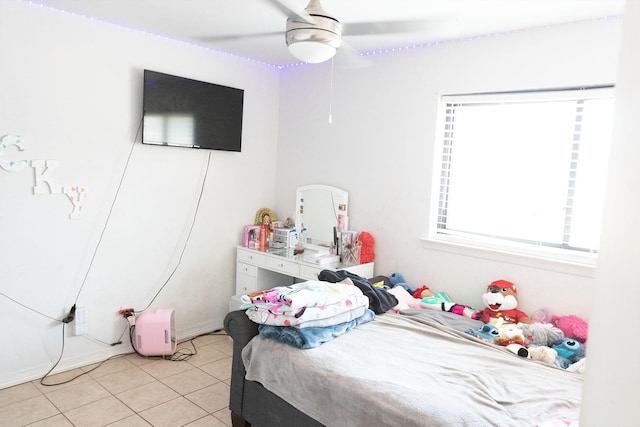 tiled bedroom with ceiling fan