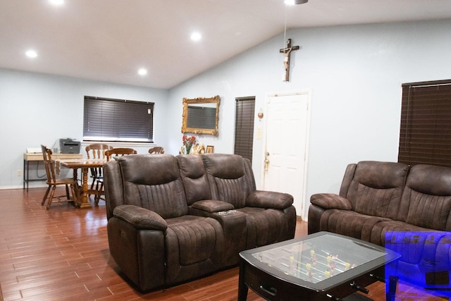 living room with wood-type flooring and lofted ceiling