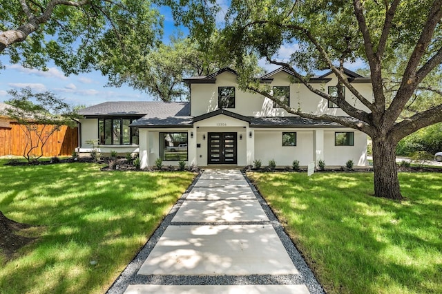 view of front facade with french doors and a front yard