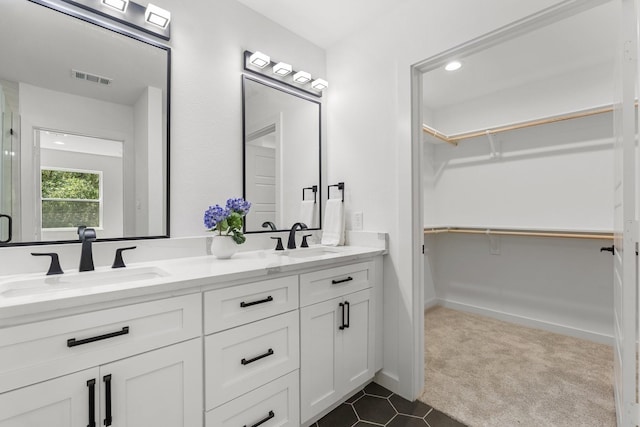 bathroom with vanity and tile patterned floors