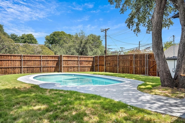 view of swimming pool with a yard, a fenced backyard, and a fenced in pool