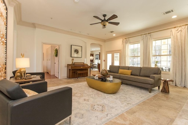 living room featuring crown molding and ceiling fan