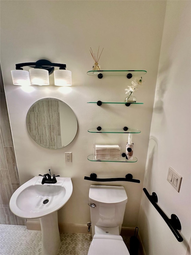 bathroom featuring tile patterned floors and toilet