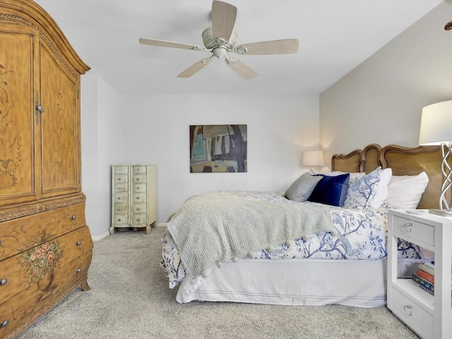 bedroom featuring ceiling fan and light carpet