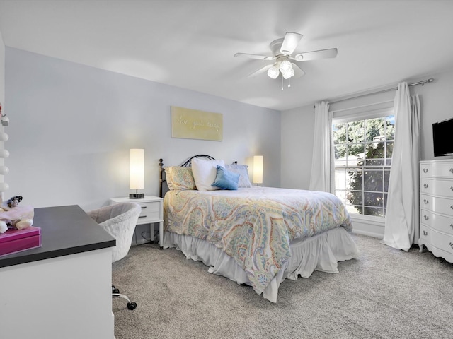 bedroom with ceiling fan and light carpet