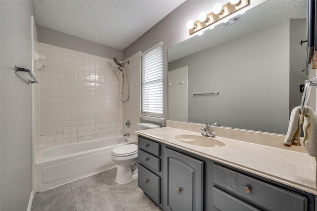 bathroom with visible vents, toilet, tub / shower combination, vanity, and a textured ceiling