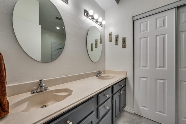 bathroom featuring double vanity and a sink