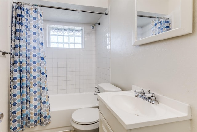 full bathroom featuring vanity, toilet, and shower / tub combo