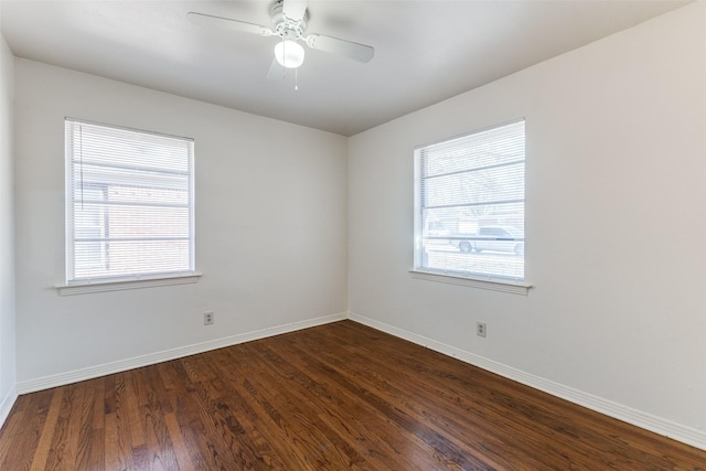 unfurnished room with ceiling fan, a healthy amount of sunlight, and dark hardwood / wood-style floors