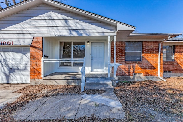 view of front of home with a garage and covered porch