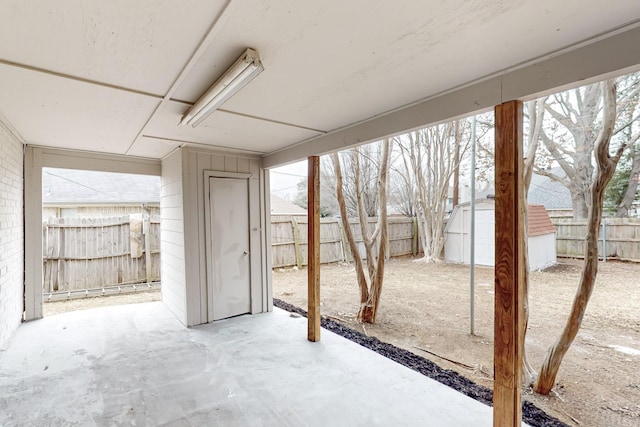 view of patio with a shed