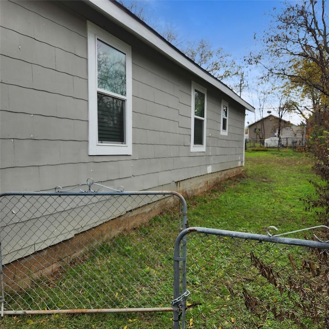 view of property exterior featuring a lawn