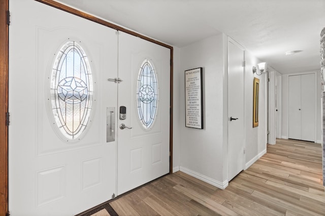 entrance foyer featuring light wood-type flooring