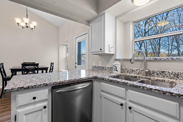 kitchen featuring sink, white cabinetry, a notable chandelier, decorative light fixtures, and stainless steel dishwasher