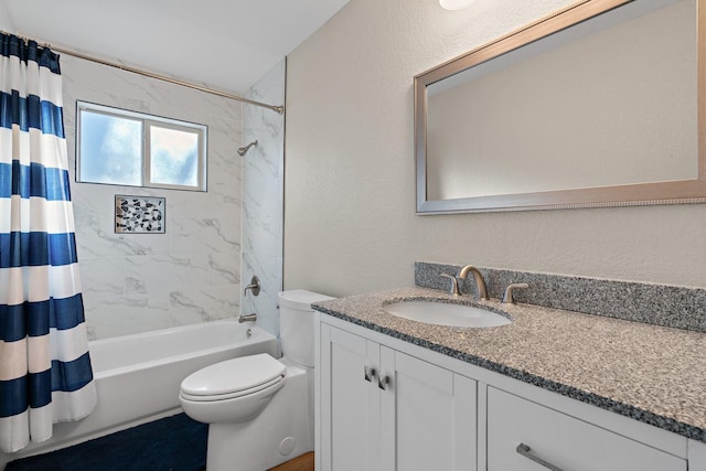 full bathroom with shower / tub combo with curtain, vanity, and toilet