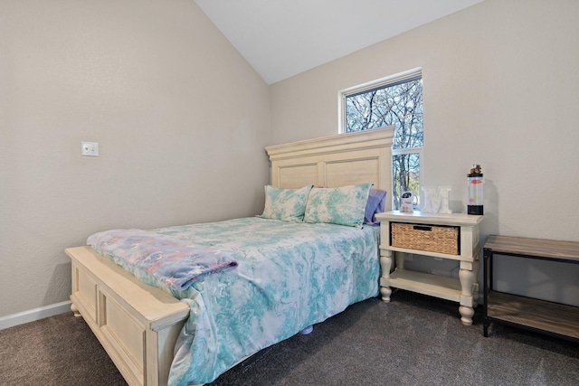 bedroom featuring vaulted ceiling and dark carpet