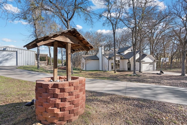 view of yard with a garage and an outdoor structure