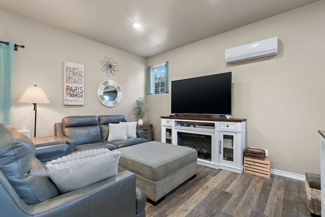 living room featuring dark hardwood / wood-style floors and a wall unit AC