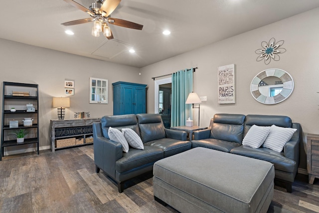 living room featuring dark hardwood / wood-style flooring and ceiling fan