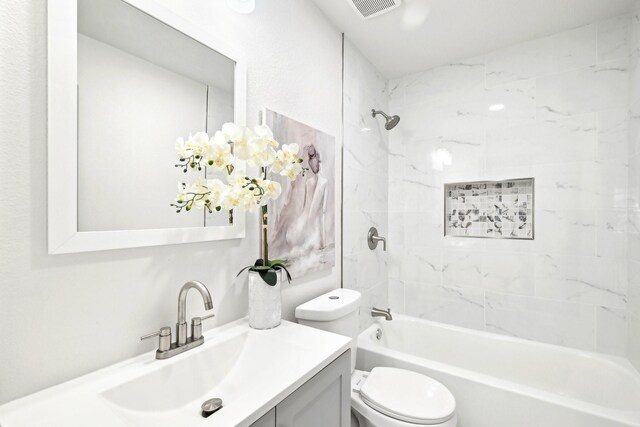 kitchen with tasteful backsplash, white cabinetry, sink, stainless steel appliances, and light wood-type flooring