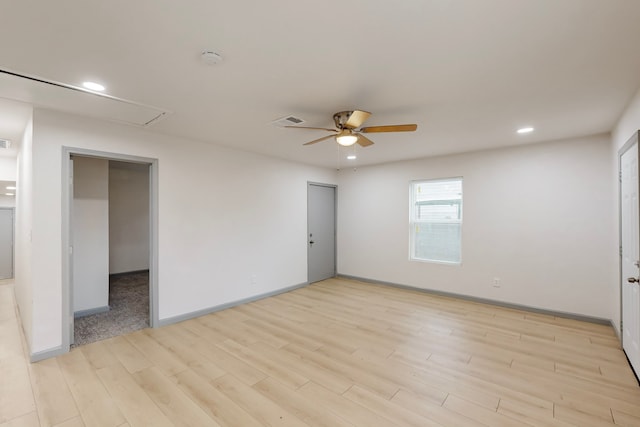 spare room with light hardwood / wood-style flooring and ceiling fan