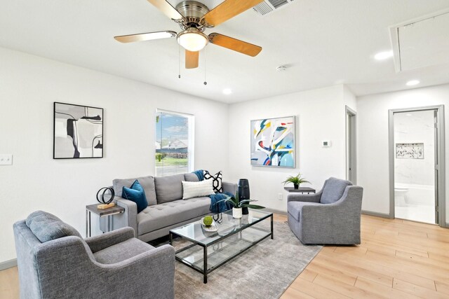 spare room featuring ceiling fan and light hardwood / wood-style flooring