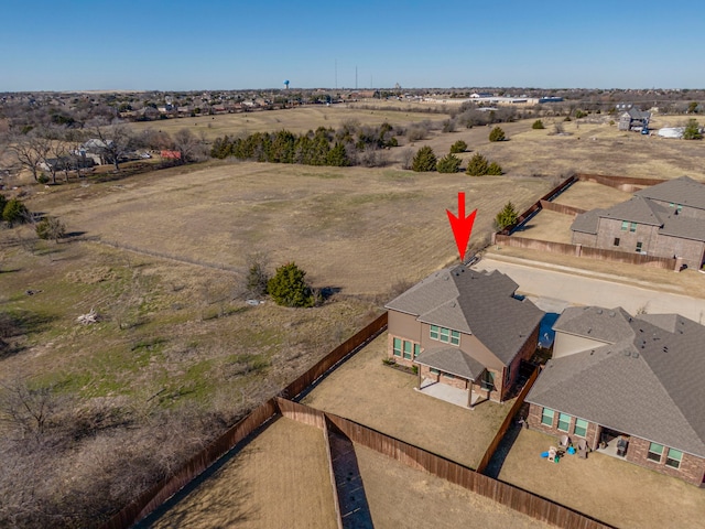 birds eye view of property with a rural view