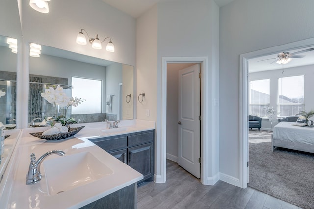 bathroom with vanity, hardwood / wood-style floors, and ceiling fan