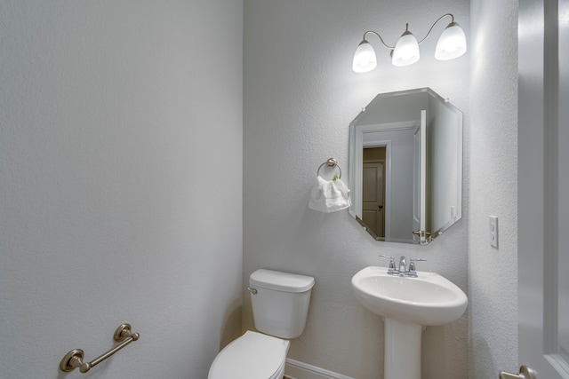 bathroom with toilet and sink