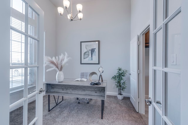 office featuring an inviting chandelier, light colored carpet, and french doors