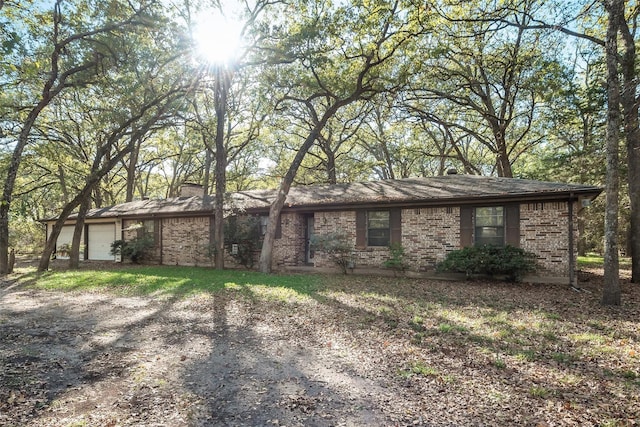 single story home with a garage